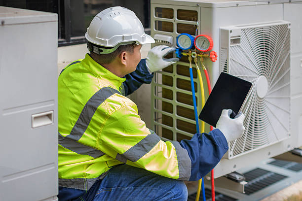 Professional Heat Pump Repair technician working in Waddy, KY